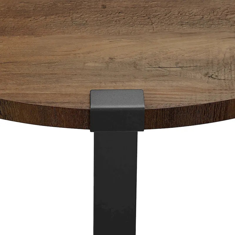 Table basse ronde industrielle avec plateau aspect bois et piètement en X en métal